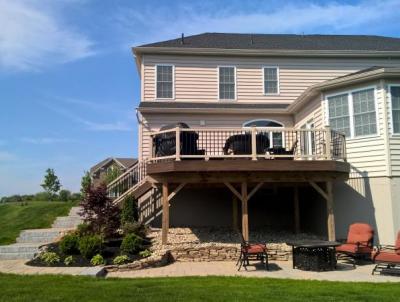 Deck and patio installation in Collegeville give multiple areas for seating.