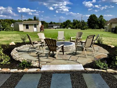 Flagstone patio surrounding firepit in Limerick Flagstone patio surrounding firepit in Limerick