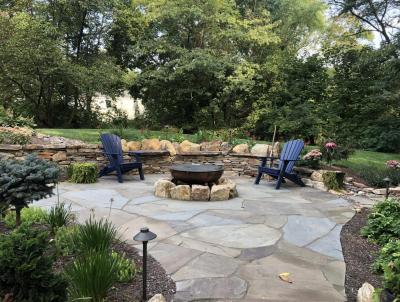 Irregular flagstone patio in Pottstown with fire pit and natural stone walls. Irregular flagstone patio in Pottstown with fire pit and natural stone walls.