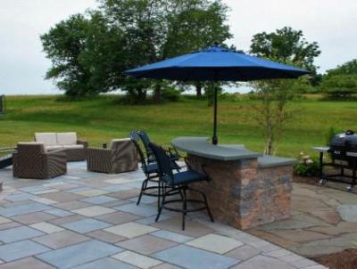 Patio space in Phoenixville accommodates room for conversation and a bar. area.
