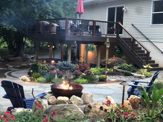 The landscaping around this Pottstown flagstone patio adds significantly to its outdoor living appeal.