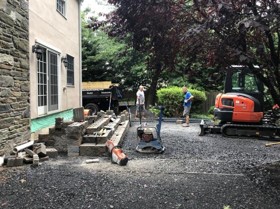 Tearing out the old deck and the anticipation of the new patio.