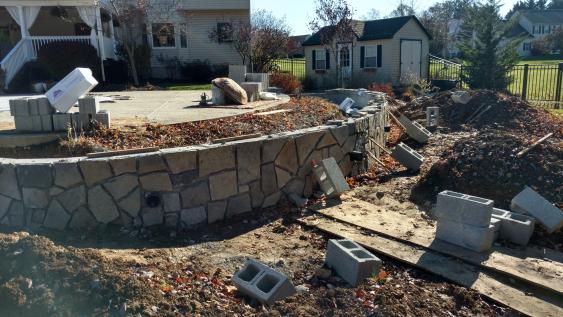 'After' natural stone veneer wall is completed in Glenmoore.