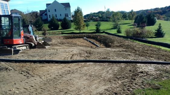 Start of a rain garden.  After excavation and grading, soil will be amended and native plants will be added.  A rain garden makes the best use of collecting and managing Mother Nature's downpours.