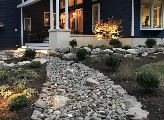 River rock and boulders enhance this Spring City, PA entrance.