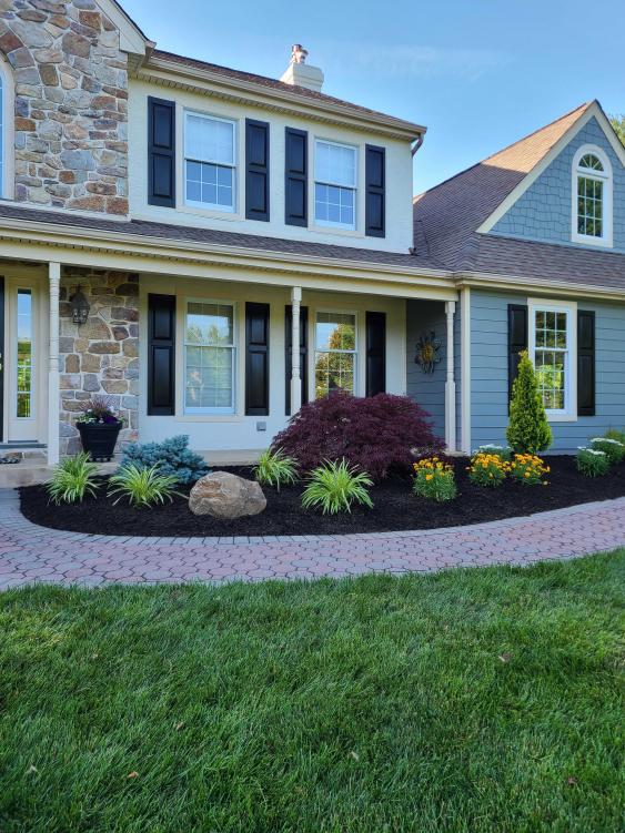 A curved bed creates more landscape interest.