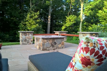 Fire pit in Pottstown, PA with chaise lounge and pillow