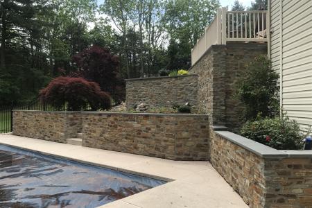 Multi level retaining wall with stone veneer in Schwenksville, PA