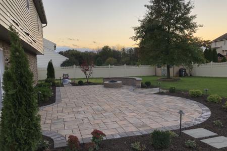 Douglassville paver patio with fire pit and sitting wall