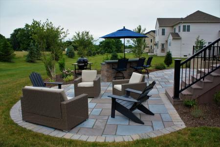 Patio in Phoenixville, PA with chairs, steps and stone bar