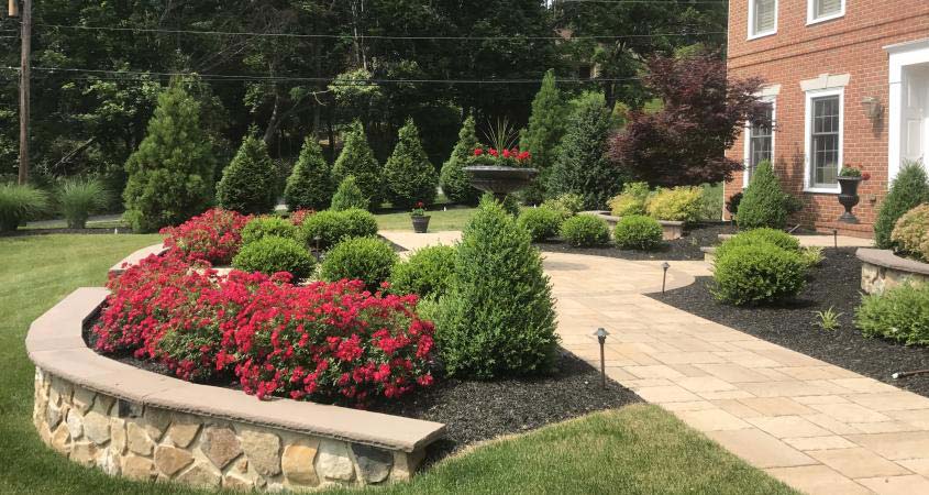 Landscaping, retaining wall, paver walkway and circular inlet in Malvern, PA