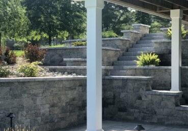 Techo- Bloc Mini-Creta tiered retaining wall allows access to a new patio area.